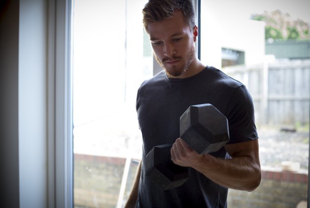 Young Man Lifting Weights