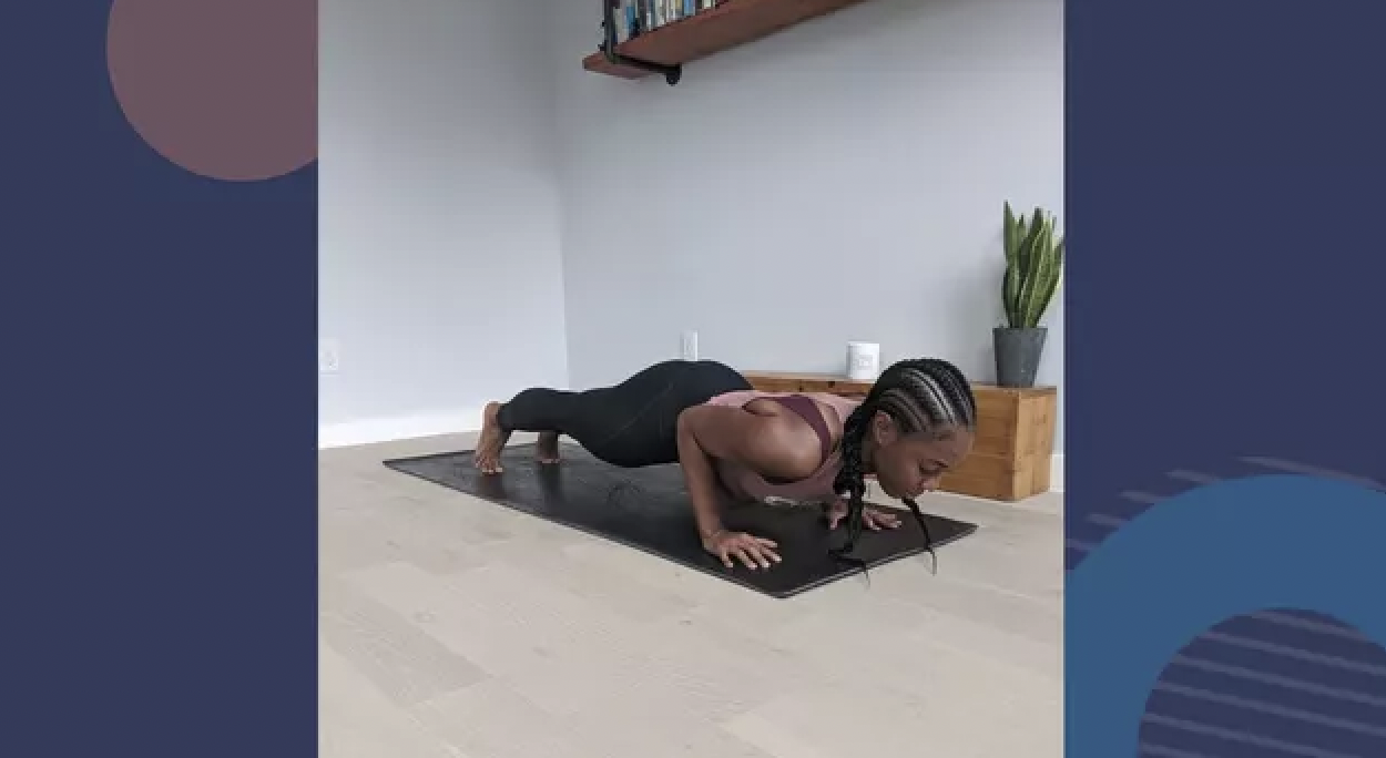 Woman doing low plank pose chaturanga dandasana ex