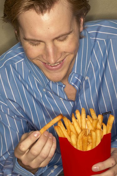 Man eating french fries