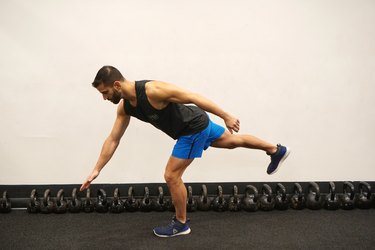 Man demonstrating how to do body-weight single-leg deadlifts