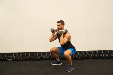 Man demonstrating how to do dumbbell front squats