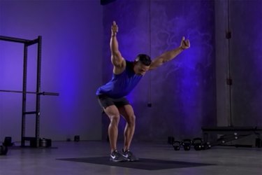 Woman demonstrating how to do the Y portion of Y, T, W mobility exercise