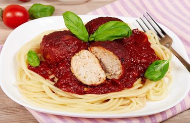 Turkey Basil Meatballs and spaghetti on white plate