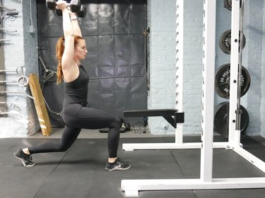 Proper form for reverse lunge to overhead press.