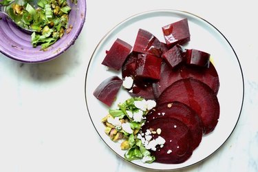 Roasted beets with basil-pistachio pesto is a red and green dish perfect for Christmas.