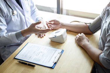 patient getting their blood pressure taken