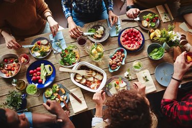 Table filled with plates and food for a low-cholesterol diet