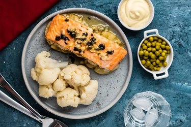 healthy dinner idea of salmon and cauliflower with cream sauce and peas