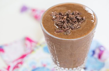 Mochaccino Smoothie in a glass topped with cacao nibs