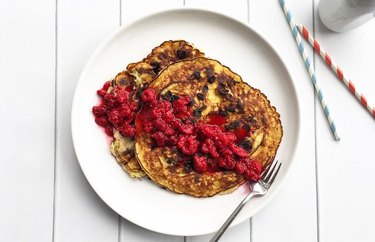 Flourless Chocolate Chip Dessert Pancakes with Smashed Raspberries