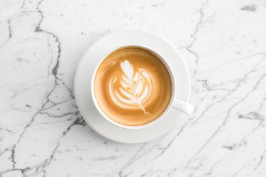 top view of a cup of coffee, as an example of foods that cause body odor