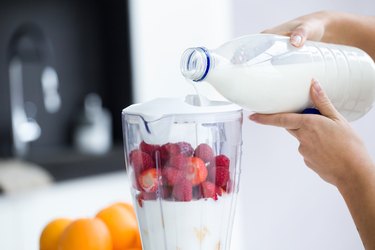 Dairy free lactose free milk pouring into blender for smoothie