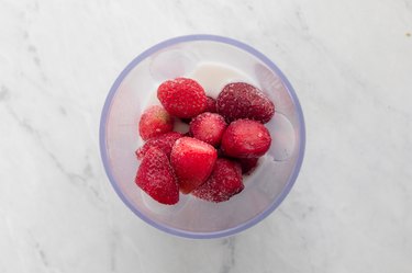 Strawberries and coconut milk  in blender