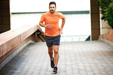 Man running outside as part of his 10K training
