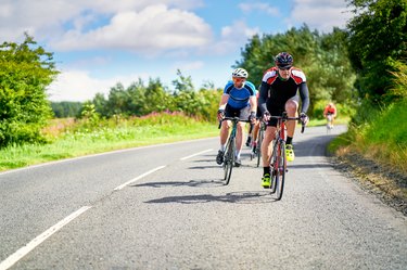 Man riding racing bicycles on the road