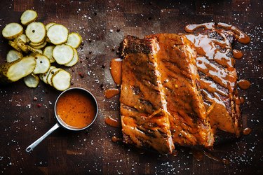 Cook barbecue ribs in an oven and on a grill