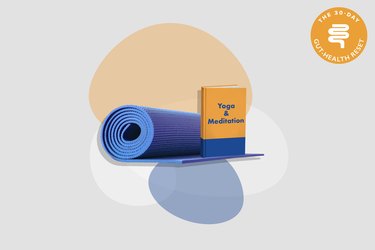 yoga mat with orange yoga and meditation book on gray background with colorful shapes