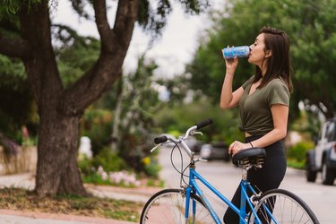 woman standing with her bike