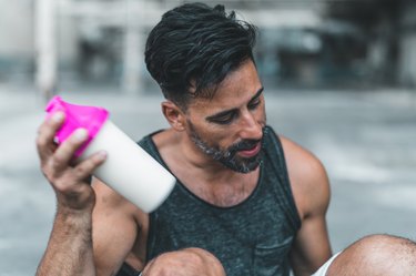 Man with sports nutrition protein shake
