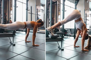 Woman using the rowing machine for pike ups during a HIIT cardio workout