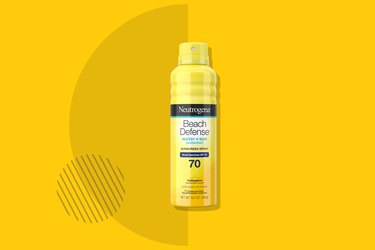 Neutrogena Beach Defense Oil-Free Spray Sunscreen on yellow background
