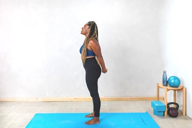 woman doing a chest and shoulder stretch