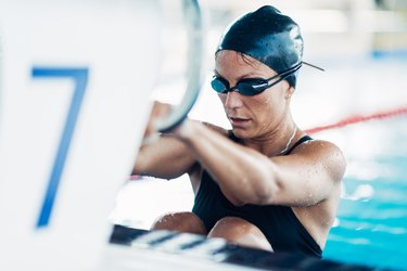 Mid Adult Woman Swimming In Pool