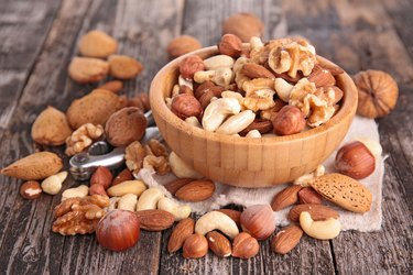 assorted nuts in wooden bowl