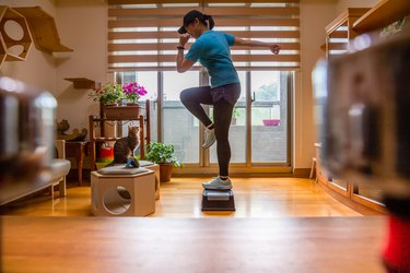 Woman Doing a Step Aerobics Workout at Home