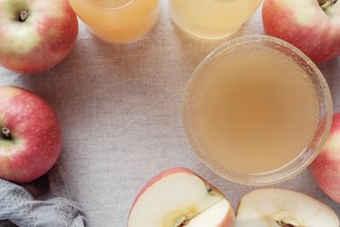 Apple cider vinegar with mother in glass bowl, probiotics food for gut health