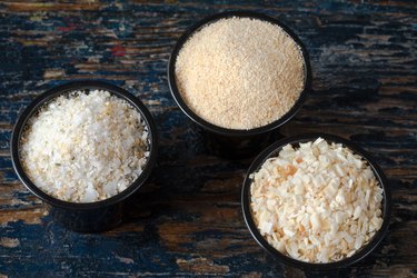 High Angle View Of Minced Onion With Garlic Salt And Powder In Bowls On Wooden Table