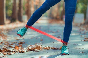 Woman Exercising with Resistance Band