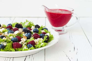 Green mixed berry salad with seeds, blue cheese and almonds
