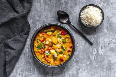 Curry dish, sweet potato curry, sugar pea, paprika, zucchini, coconut milk, shrimps and rice