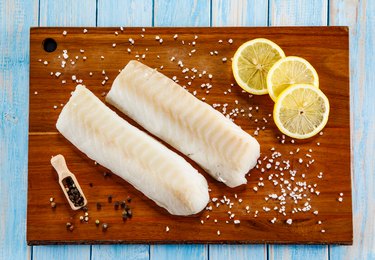 Fresh raw grouper fillet on cutting board