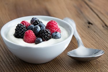 Bowl of fresh mixed berries and yogurt