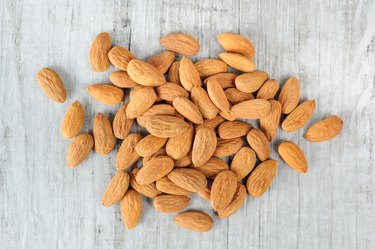 High Angle View Of Almonds On Wood