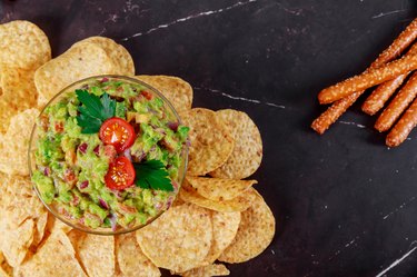 Mexican food nachos guacamole, doritos and tortilla chips