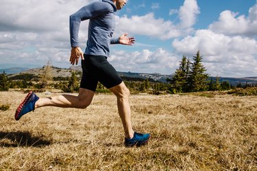 Man trail running wearing compression shorts