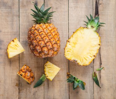 Directly Above Shot Of Pineapples On Cutting Board