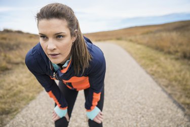 Runner resting on rural path