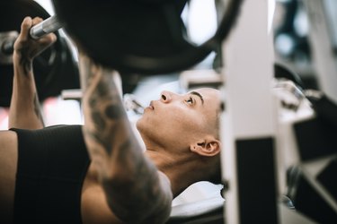 Strong and Fit Woman Working Out in Gym