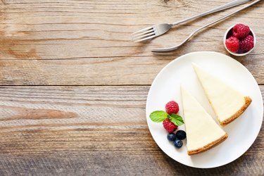 Two slices of cheesecake and fresh berries