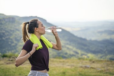 Teen spirit. Beautiful Teenage girl taking a break after training outdoors in the nature.