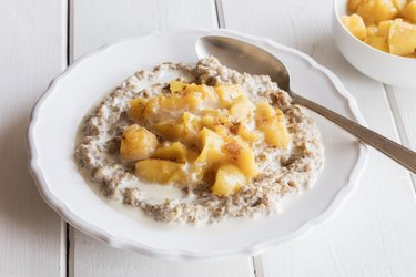 Plate of rye porridge with peach compote