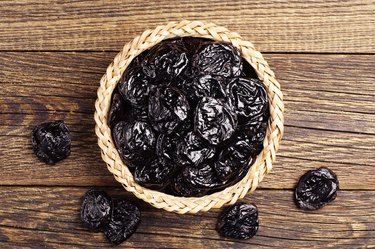 Dried plum in wicker bowl