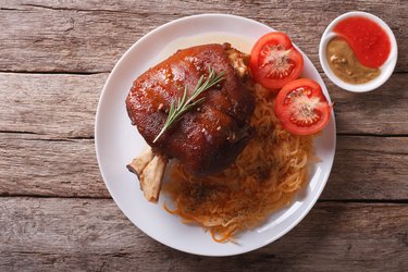 pork shank, sauerkraut and sauce. horizontal top view