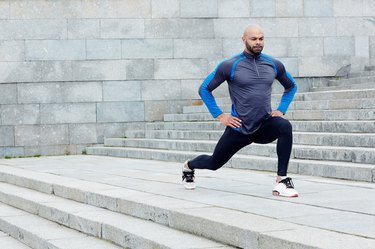 Man doing lunge exercise outdoors to build lower-body strength