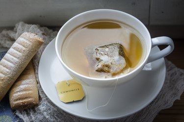 Chamomile tea and biscuits on window sill