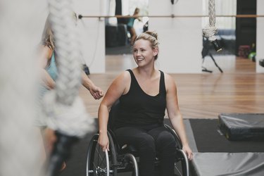 Paraplegic woman in a gym